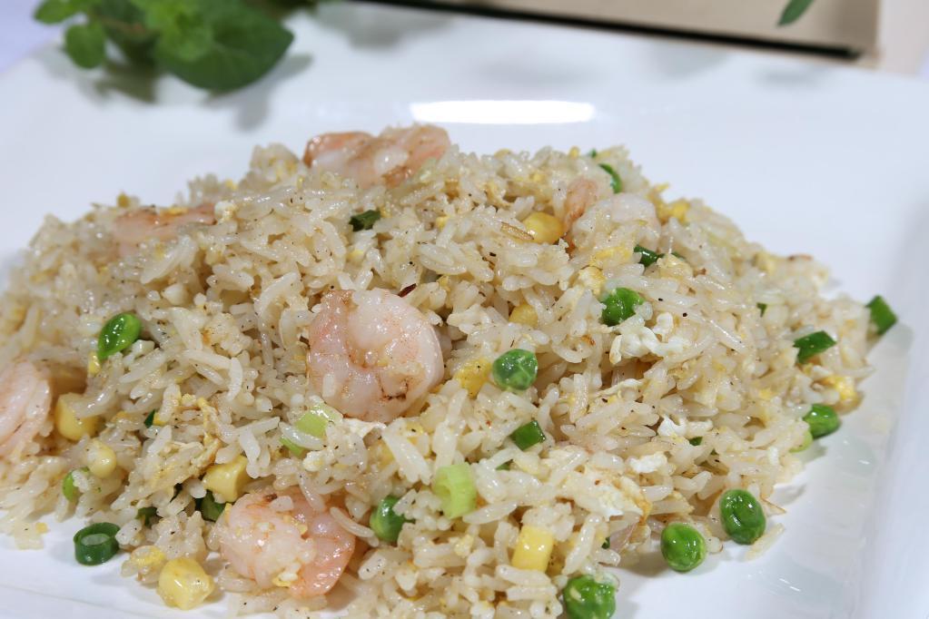 Fried Rice Rice Plate · Choice of chicken, pork, or shrimp, onions, green peas, corn and eggs.  Rice plates (com phan) includes steamed white jasmine or brown rice.
