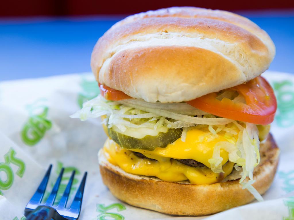 Geno's Classic Burger · Lettuce, tomato, onions, pickle, and yellow American cheese.