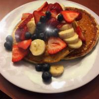 Homemade Pancakes · Fresh fruits, walnuts, raisins or cranberries. Served with maple syrup.