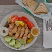 Grilled Chicken Greek Salad · An athena Greek salad with marinated grilled chicken. Served with vinaigrette dressing and p...