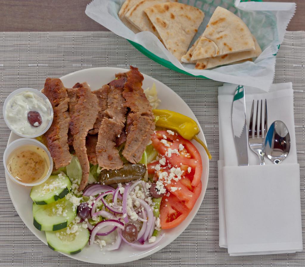 Gyro Salad · An athena Greek salad with shaved gyro meat. Served with tzatziki sauce, our Greek dressing and pita.