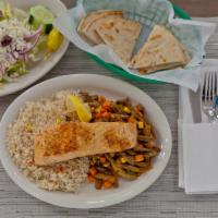Grilled Salmon Salad · An athena Greek salad with fresh grilled salmon. Served with a piece with lemon, vinaigrette...