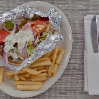 Greek Bifteki Pita · Housemade beef patty with spices and herbs on pita bread with tomato, red onions and tzatziki.