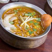 Chana Masala · Garbanzo beans cooked with onions, tomatoes and spices. Served with rice.