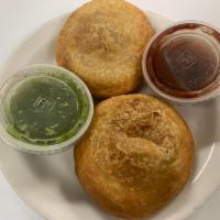 Khasta Kachori · 2 Crispy Dough Balls Stuffed with Lentils and Spices. Served with Tamarind and Mint Chutney