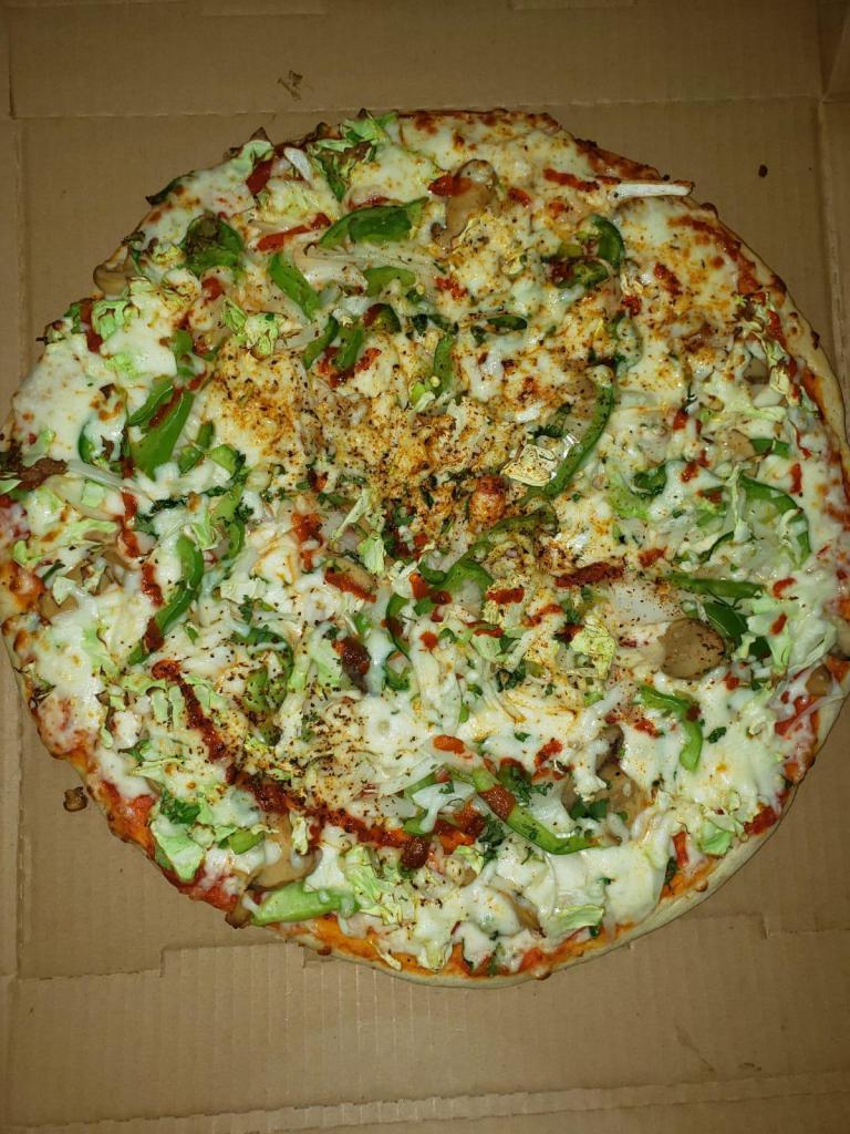Veggie Pizza (16'' Large) · Sriracha Red Sauce with Mozzarella, Cabbage, Bell Peppers, Mushrooms, Onions, Fresh Jalapenos, Tomato, Ginger, Garlic,Cilantro and Cajun Seasoning.