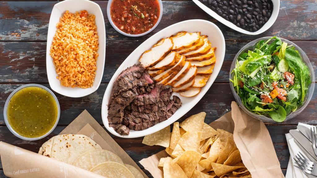 Family Meal Steak · 1.25 lbs grass-fed steak, 16 ounces of Mexican Rice, 16 ounces of Black Beans, 2x side salad, 4 flour and 6 corn tortillas, (1) 8 oz container Sharky’s Salsa, (1) 8 oz container Salsa Verde, and chips