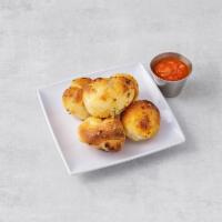 5 Garlic Knots · Served with tomato sauce.