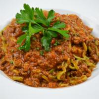 Tallarines Boloñesa · Homemade thin spinach pasta & lean ground beef ragu.