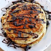 3 Chocolate Chip Pancakes · 3 buttermilk pancakes loaded w/ choc chips and chocolate drizzle.