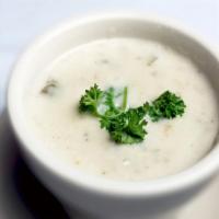 New England Clam Chowder · White creamy thick chowder with fresh clams onions and potato.