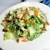 Caesar Salad · Served with shaved parmesan cheese and homemade croutons and anchovy paste.