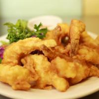 6 Butterfly Shrimp · Deep fried jumbo shrimp, accompanied with homemade sweet-sour sauce.