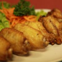 Thai Spiced Wings · Chicken wings, marinated in Thai spices then deep fried. Served with homemade house sauce.