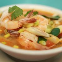 Bowl of Tom Yum · Spicy and tangy broth flavored with lemon grass, lime juice, Thai chili and fresh mushrooms.
