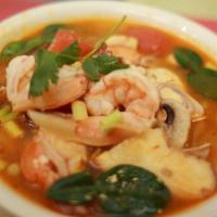 Hot Pot Tom Yum · Spicy and tangy broth flavored with lemon grass, lime juice, Thai chili and fresh mushrooms.