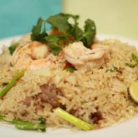 Thai Fried Rice · Thai style fried rice tossed with egg, tomatoes, white and green onions.