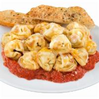 Baked Cheese Tortellini · Baked cheese tortellini served with your choice of sauce. Includes personal garlic bread and...