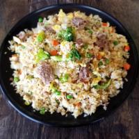 Beef Fried Rice · Peas, carrots, broccoli, eggs and beef. Extra meat for an additional charge.