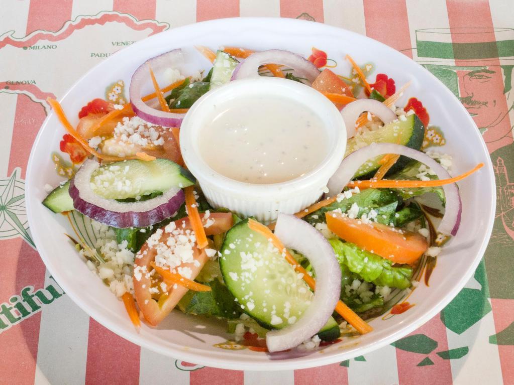House Salad · Mixed romaine and iceberg lettuce, tomatoes, cucumbers, onions, carrots and peppers.