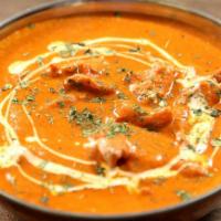 Butter Chicken Curry · Chicken skewed in tandoor and sautéed in thick buttery sauce.