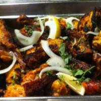 Chicken Malai Kebab · White meat seeped in sour cream and mild spices.