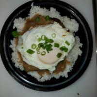Loco Moco Breakfast · Teriyaki beef patty, brown gravy, over easy egg, rice and mac salad.