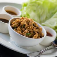 Chicken Lettuce Wraps · Roasted chicken, tofu, green onions, water chestnuts, pickled vegetables, wonton chips, swee...