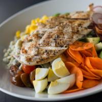 Chicken Cobb Salad · Greens, kale, baby tomatoes, edamame, carrots, radish, egg, bleu cheese, corn, bacon, avocad...