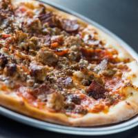 The Carnivore Pizza · Pepperoni, seasoned beef, spicy sausage, crispy bacon, mozzarella, tomato sauce.