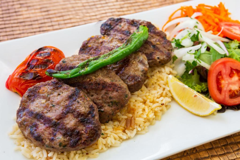 Dinner Lamb Kofte Kebab · Ground lamb blended with eggs, onions, garlic, parsley and spices. Lamb kofte contains gluten and dairy. Served with rice, grilled pepper and tomato, and side of fresh house salad.