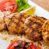 Dinner Chicken Kofte Kebab · Ground chicken blended with eggs, onions, garlic, parsley and spices. Served with rice, gril...