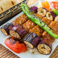 Dinner Eggplant Kebab Classic · Flavored chopped lamb served with charcoal-grilled eggplant. Served with rice, grilled peppe...