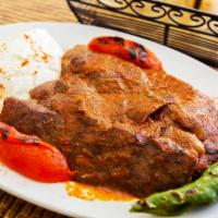 Iskender  · Sauteed buttered bread topped over sliced lamb gyro. Served with fresh tomato sauce, yogurt,...