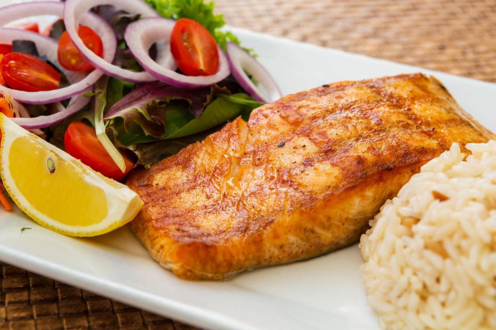 Salmon · Broiled filet salmon in our special marination. Served with rice, fresh house salad, grilled pepper and tomato.