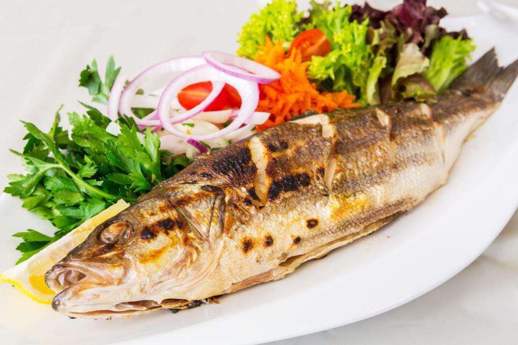 Bronzini · Grilled Mediterranean sea bass served with fresh house salad.