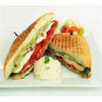 19. Chicken Panini · Grilled skinless chicken breast, grilled onions, sun-dried tomatoes, Swiss, mayo pesto sprea...