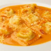 Ravioli Piamontese · Filled with spinach and cheese in a pink sauce.