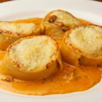 Rottolo Montanara · Homemade pasta rolled and filled with spinach, ricotta and wild mushrooms in a pink sauce wi...