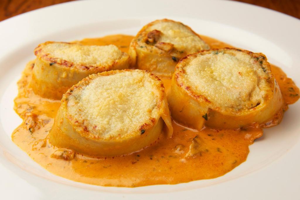 Rottolo Montanara · Homemade pasta rolled and filled with spinach, ricotta and wild mushrooms in a pink sauce with Parmesan.