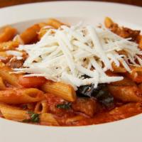 Penne Alle Melanzane · With eggplant, fresh tomatoes and shaved dry ricotta.