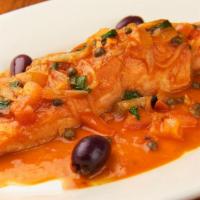 Salmone Livornese · Salmon sauteed with onions, capers, black olives and fresh tomatoes.