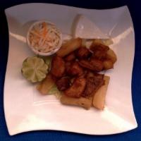 Yuca con Chicharron · Fried yuca with pork. With cole salad and soft cheese