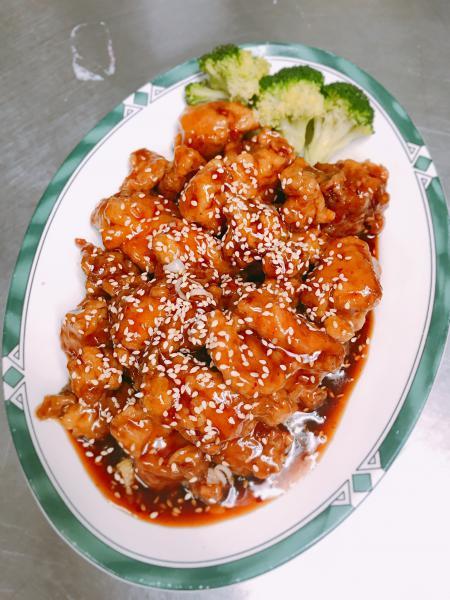 C20. Sesame Chicken · Chicken dark meat battered, fried, sauteed with in our sweet and spicy sesame sauce garnished with steamed broccoli. Spicy.