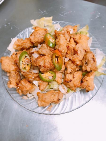 C21. Salt and Pepper Chicken · Chicken dark meat battered, fried then sauteed with caramelized onions and jalapeno in our special salt and pepper seasoning blend. Spicy.