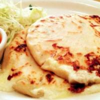 Pupusas · Thick and handmade corn tortilla prepared with a variety of fillings.