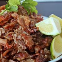 Carnitas · Pulled pork platter. Includes tortillas, beans, rice and salad.
