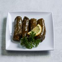 Grape Leaves · Grape leaves stuffed with rice and fresh tomato. Vegetarian.