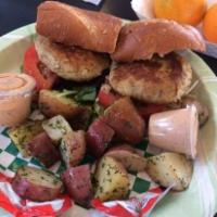 Crab Cake  Po Boy · Two of Chef Doucette’s crab cakes served on a po'boy with choice of grilled potatoes or side...