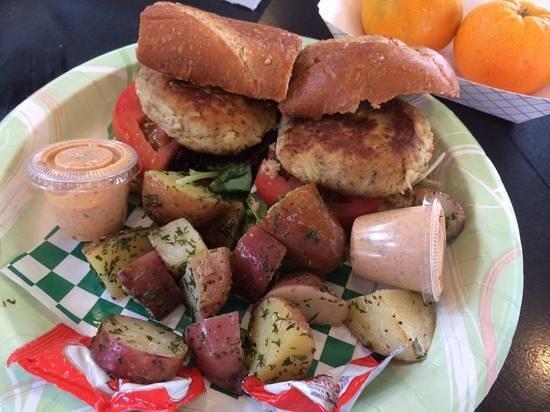 Crab Cake  Po Boy · Two of Chef Doucette’s crab cakes served on a po'boy with choice of grilled potatoes or side salad.  Dressed with spring mix, tomato and our Remoulade sauce.